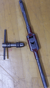 tap (used to thread a hole) and tap handles