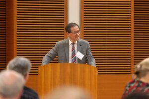 a man stands at a podium
